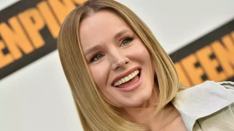 Kristen Bell and Dax Shepherd with matching purple hair.