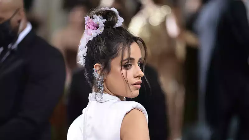 Camila Cabello wears custom-made flowers in her hair at the 2022 Met Gala.