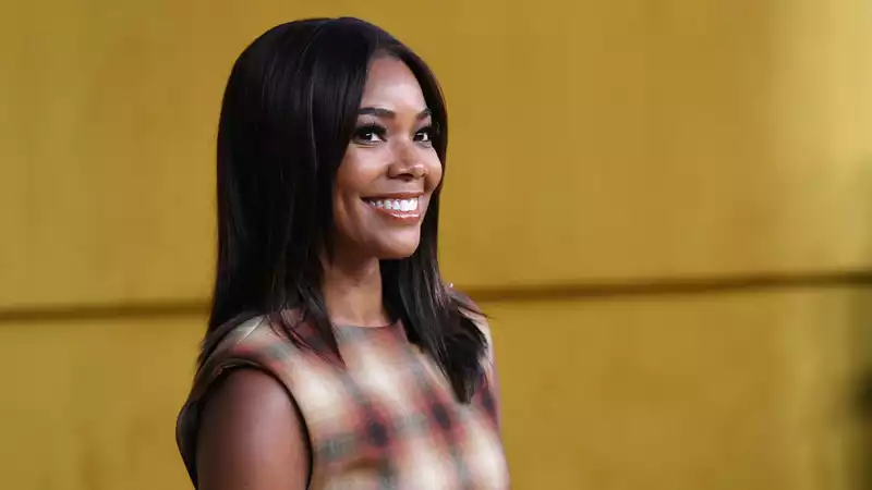 Gabrielle Union graces the beach with a head wrap from black-owned brand YGN