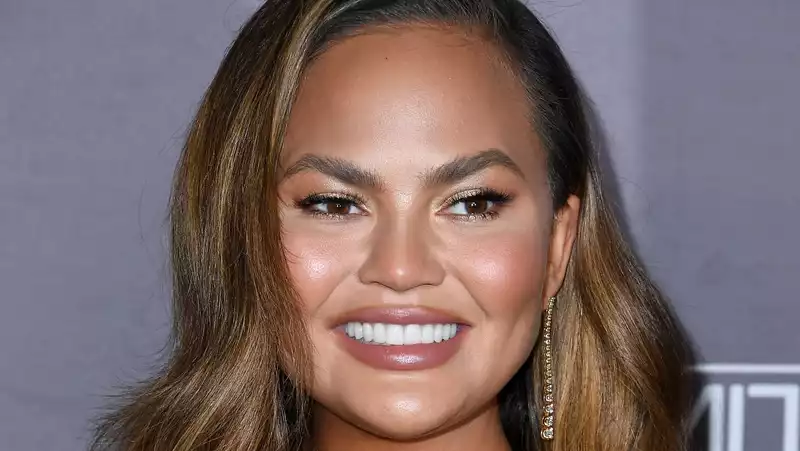 Chrissy Teigen responds to criticism for releasing a video of her coronavirus test.