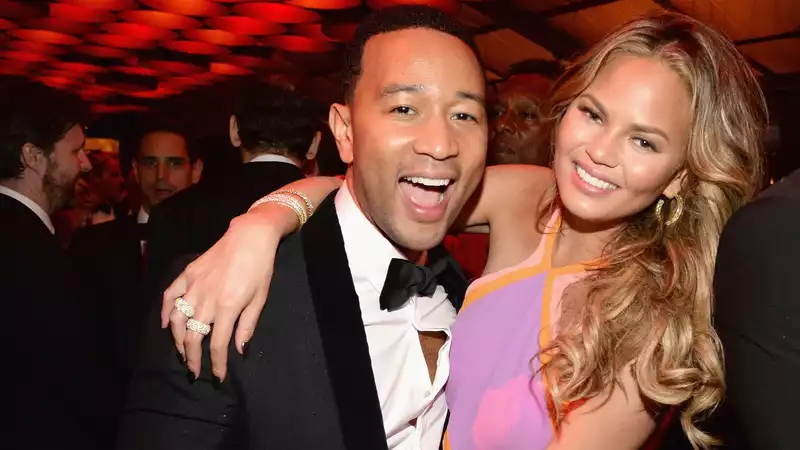 Chrissy Teigen joins John Legend's Instagram Live in just a towel.