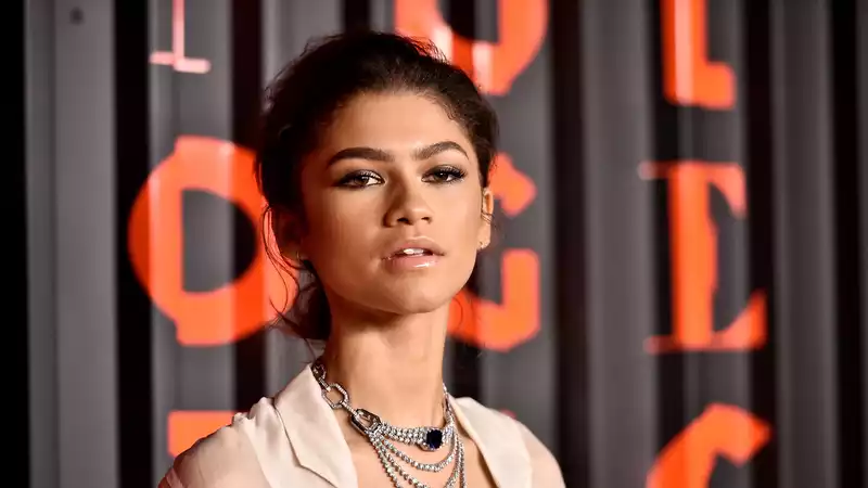 Zendaya wears a deep V shirtdress and diamond layers to a Bulgari event