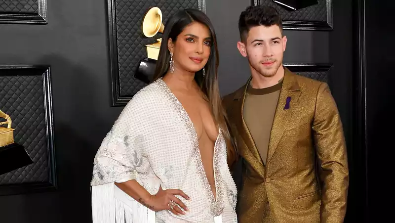 Priyanka Chopra and Nick Jonas in plunging dresses and gold suits at the Grammy Awards