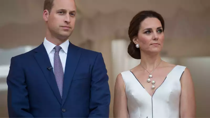 Prince William and Princess Kate are photographed chatting with Princess Rajwa of Jordan.