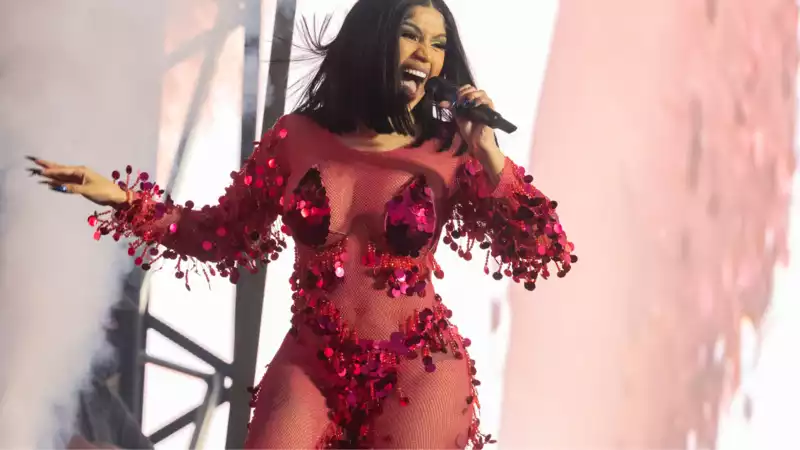 Cardi B. throws a microphone at an audience member who poured a drink on her.