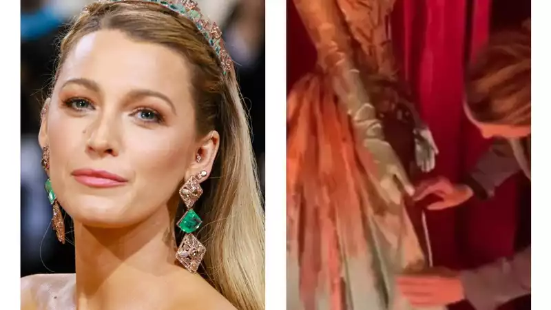 Blake Lively jumps over the rope at an exhibit to fix her 2022 Met Gala gown on display at Kensington Palace.