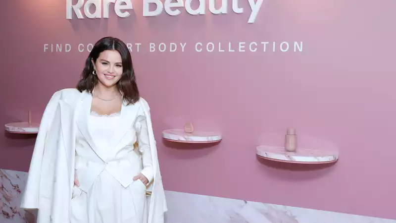 Selena Gomez, a dazzling vision in rare beauty white.