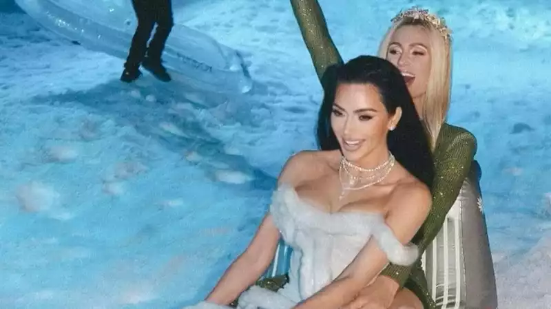 Paris Hilton and Kim Kardashian Shimmer in New Christmas Eve Photos