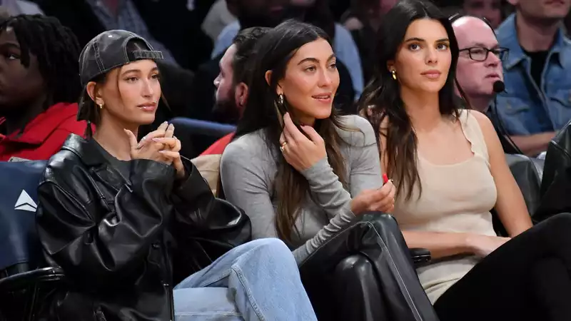 Haley Bieber and Kendall Jenner mix friendly smiles and rude gestures at Lakers game